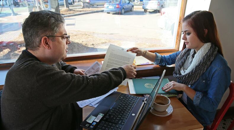 Jim Zaffiro, left, and his daughter Emily Zaffiro, 17, work on filling out a FAFSA form, which determines how much and what types of financial aid students are eligible for when starting college. MICHAEL SEARS/MILWAUKEE JOURNAL SENTINEL/TNS