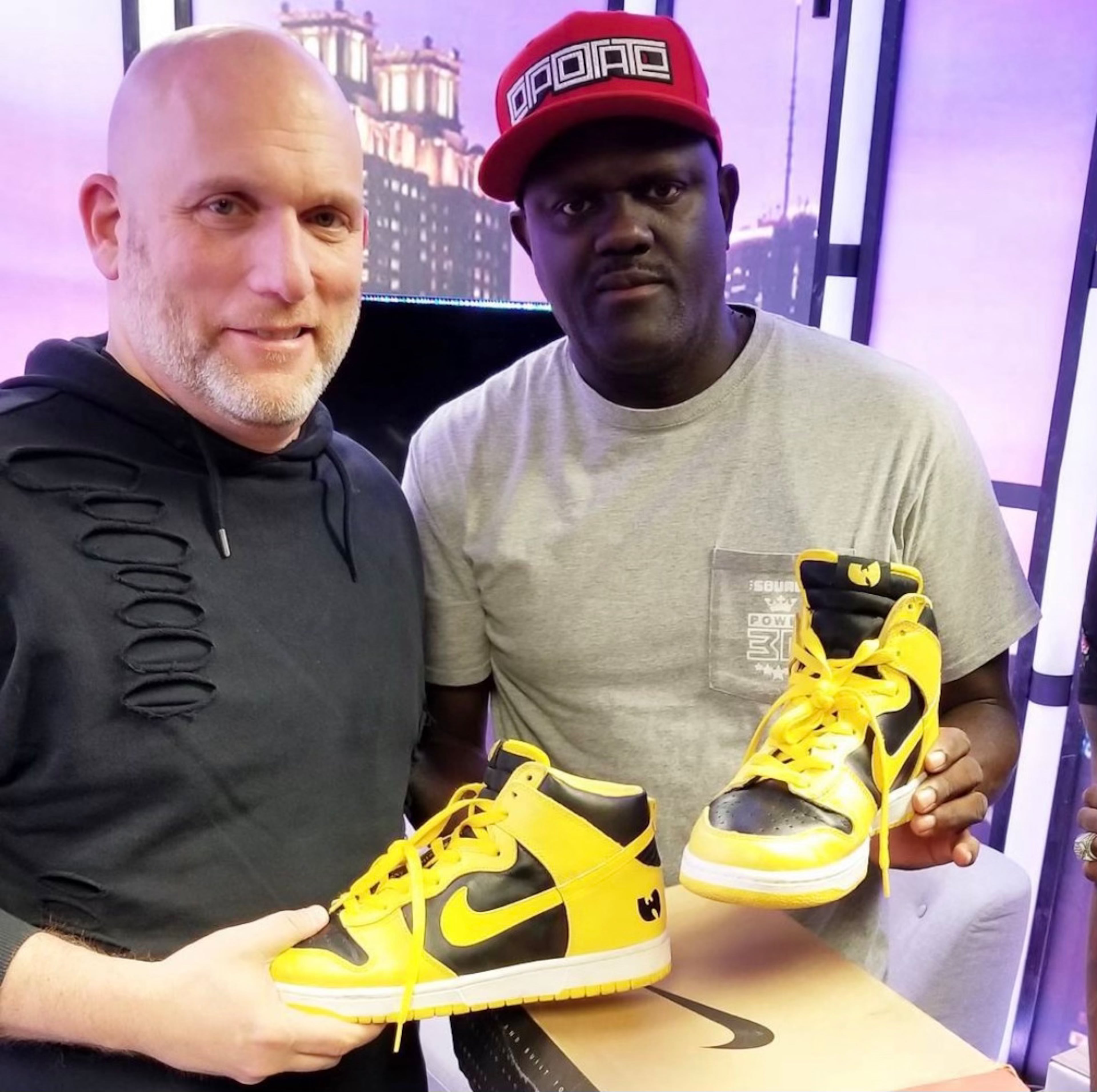 Greg Street showed off his Wu-Tang Clan x Nike Dunk High sneakers, a rare promotional item from 1999, with record executive Steve Rifkind, who helped establish the band in the 1990s. (Courtesy)