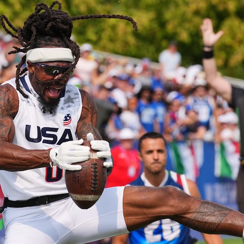 United States' Tyler "TD" Davis celebrates a touchdown during the Flag Football World Championship men's final game between Italy and USA in Duesseldorf, Germany, Sunday, Aug. 16, 2026. (AP Photo/Martin Meissner)