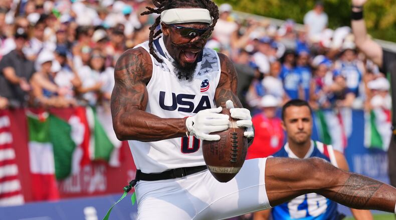 United States' Tyler "TD" Davis celebrates a touchdown during the Flag Football World Championship men's final game between Italy and USA in Duesseldorf, Germany, Sunday, Aug. 16, 2026. (AP Photo/Martin Meissner)