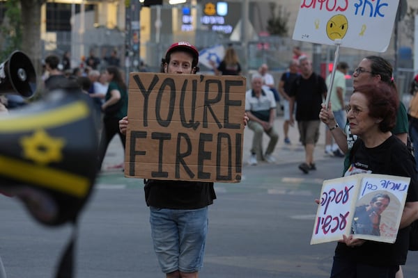 People take part in a protest demanding the end of the war and immediate release of hostages held by Hamas in the Gaza Strip, and against Prime Minister Benjamin Netanyahu's government in Tel Aviv, Israel, Saturday, June 28, 2025. (AP Photo/Ariel Schalit)