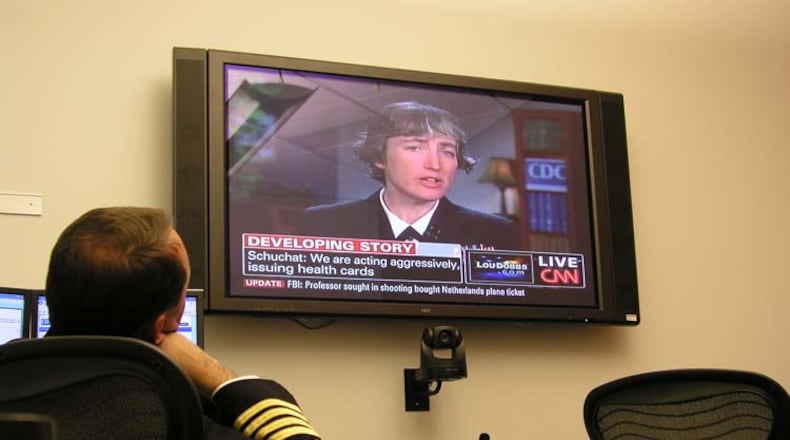 Dr. Anne Schuchat appears on CNN to give updates to the public during the 2009 H1N1 pandemic, while Daniel Jernigan, leader of the Epidemiology and Laboratory Task Force, watches. During the pandemic, Schuchat acted as the face of the CDC, keeping the public up to date on the evolving situation. CENTERS FOR DISEASE CONTROL AND PREVENTION