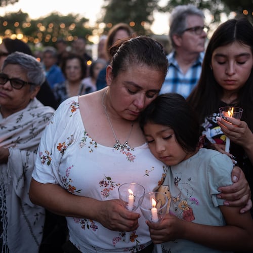 Judith Cabrera and her daughter, April, attend a vigil for the victims of a fatal SUV-Metro bus collision and the subsequent crash of a TV news helicopter covering it in the Chatsworth neighborhood of Los Angeles, Thursday, Sept. 17, 2026. (AP Photo/Jae C. Hong)