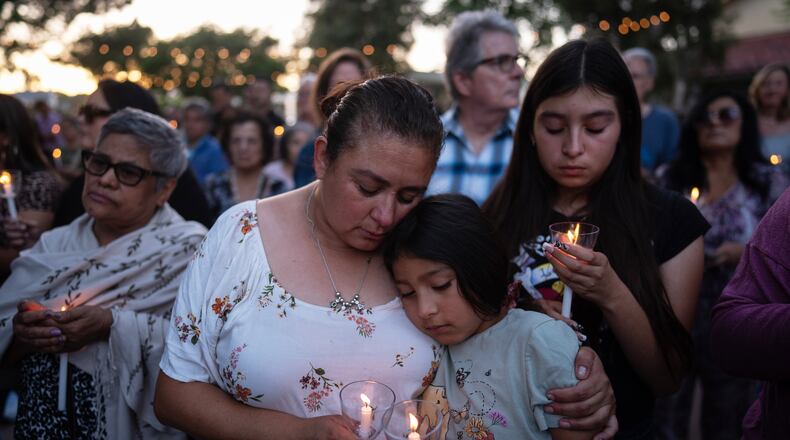 Judith Cabrera and her daughter, April, attend a vigil for the victims of a fatal SUV-Metro bus collision and the subsequent crash of a TV news helicopter covering it in the Chatsworth neighborhood of Los Angeles, Thursday, Sept. 17, 2026. (AP Photo/Jae C. Hong)
