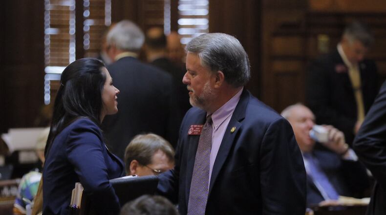 Georgia House Appropriations Chairman Terry England, R-Auburn, talks with Deputy House Budget Director Christine Murdock after the state’s $25 billion budget gains final passage. BOB ANDRES / BANDRES@AJC.COM