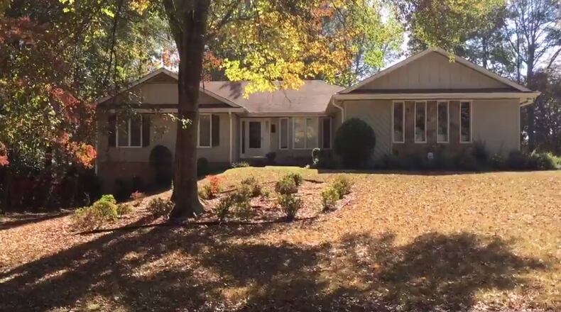 Roswell police spokeswoman Lisa Holland told Channel 2 that a woman knocked on the door and told the residents a water main was broken and she needed them to come around to the back of the house. (Credit: Channel 2 Action News)