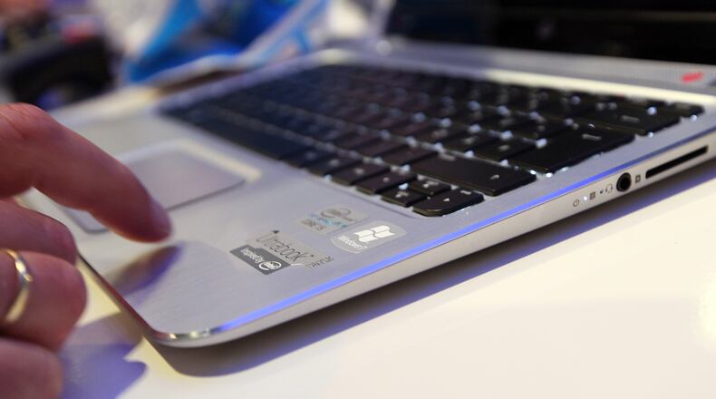 BERLIN, GERMANY - AUGUST 31: A visitor tries out an HP Spectre XT laptop computer featuring an Intel Ultrabook processor at the Internationale Funkausstellung (IFA) 2012 consumer electronics trade fair on August 31, 2012 in Berlin, Germany. IFA 2012 is open to the public from today until September 5. (Photo by Adam Berry/Getty Images)