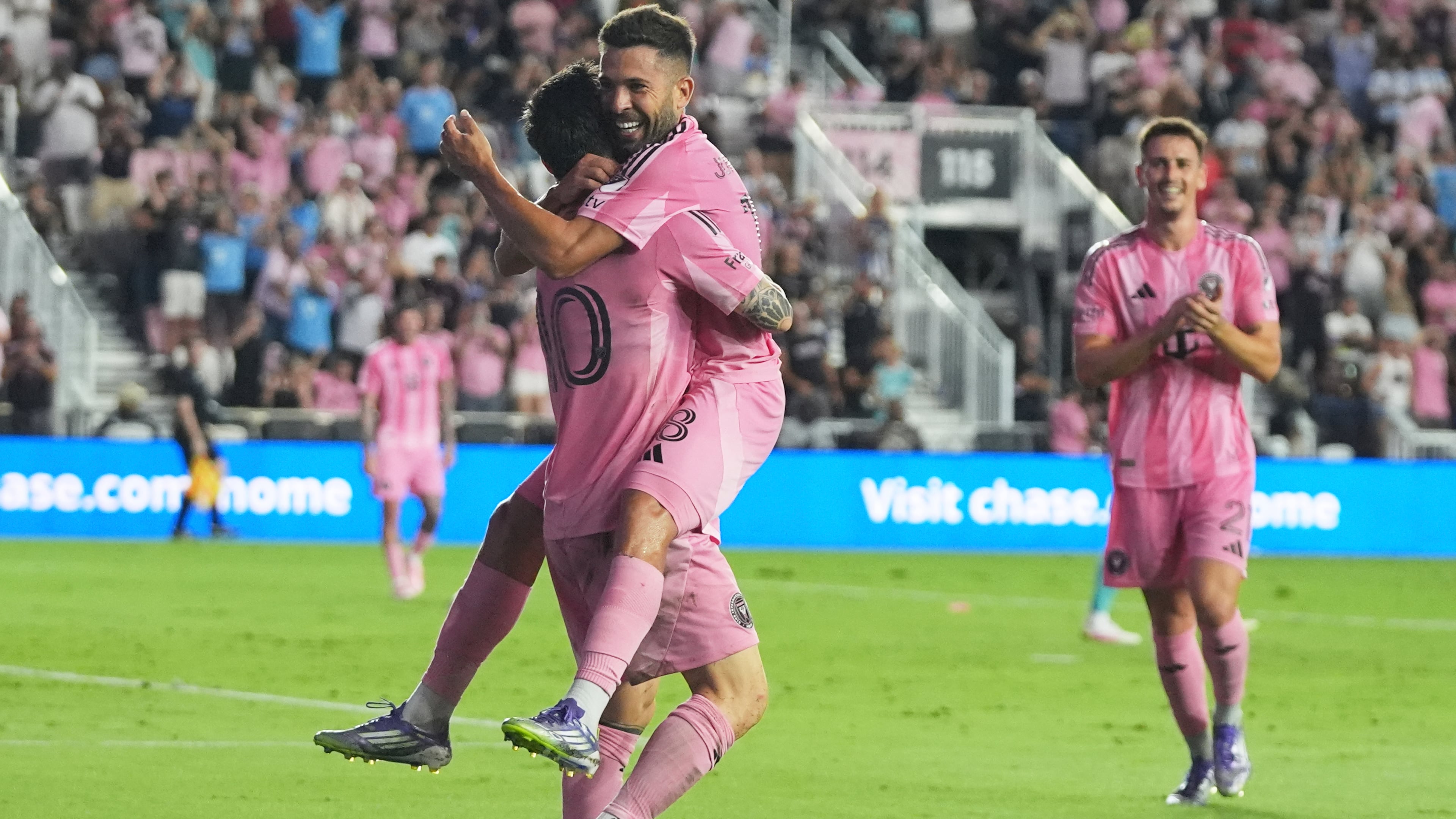 Inter Miami forward Lionel Messi, left, celebrates with defender Jordi Alba, right, after scoring a goal during the first half of an MLS soccer match against Seattle Sounders, Tuesday, Sept. 16, 2025, in Fort Lauderdale, Fla. (AP Photo/Lynne Sladky)