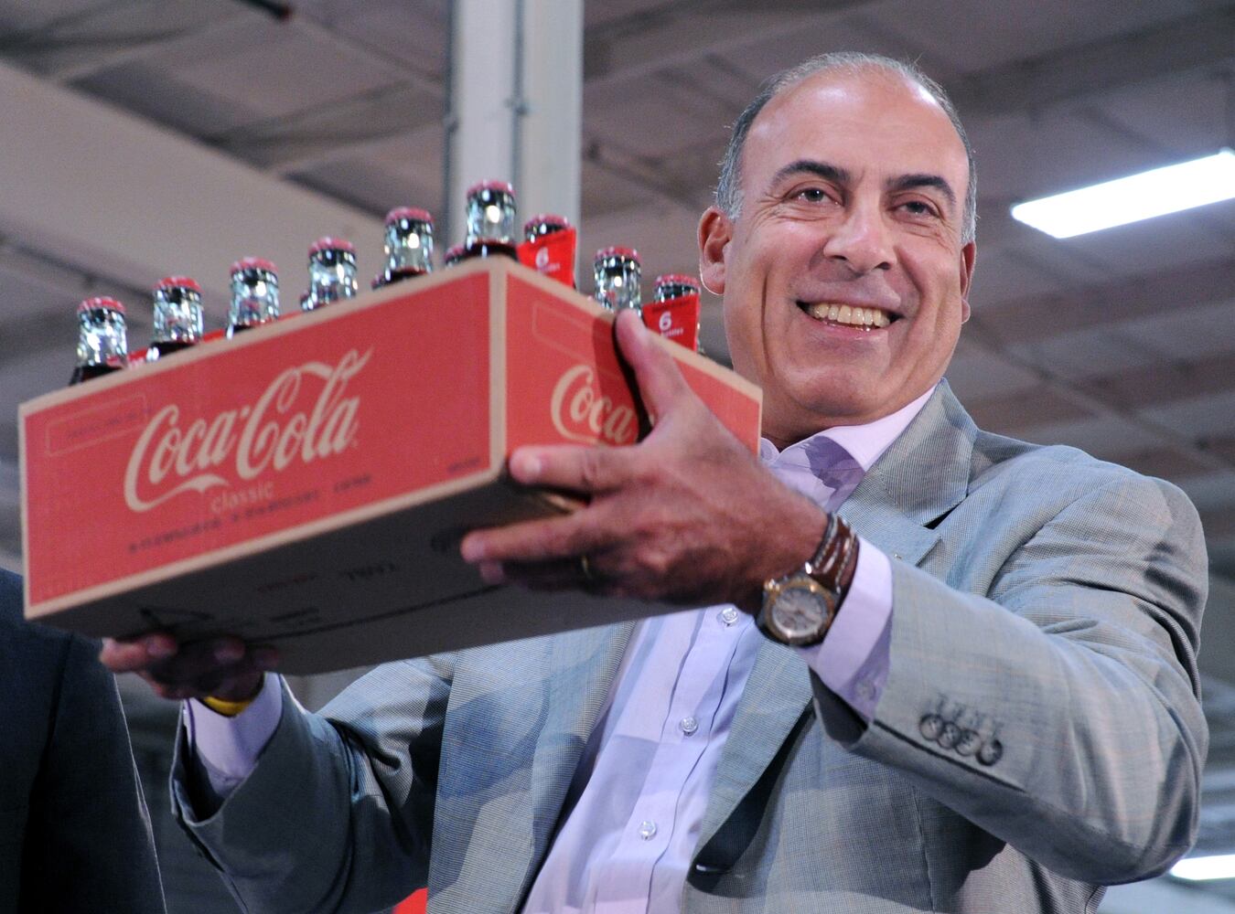 While much of Coca-Cola CEO Muhtar Kent's 2012 pay was in the form of perks in addition to cash, here are some examples of what the money could pay for.