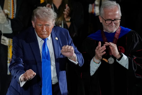 President Donald Trump dances after giving a commencement address at the University of Alabama, Thursday, May 1, 2025, in Tuscaloosa, Ala. (AP Photo/Mike Stewart)
