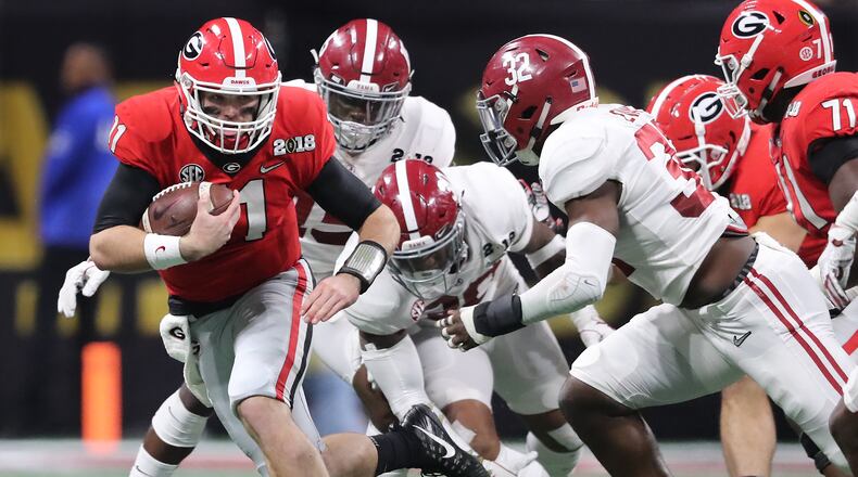 January 8, 2018 Atlanta: Jake Fromm runs for yardage on a quarterback keeper against Alabama during the first half in the College Football Playoff National Championship on Monday, January 8, 2018, in Atlanta.    Curtis Compton/ccompton@ajc.com