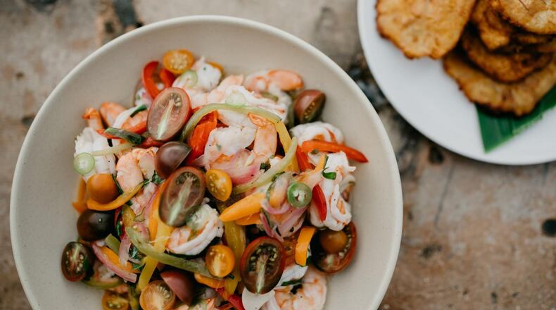 No other dish captures the beauty of Caribbean cuisine more than escabeche, writes chef and author Asha Gomez. The shrimp salad, at front, is pictured with tostones, fried green plantains, at rear. STYLING BY ASHA GOMEZ / CONTRIBUTED BY MEREDITH ZIMMERMAN