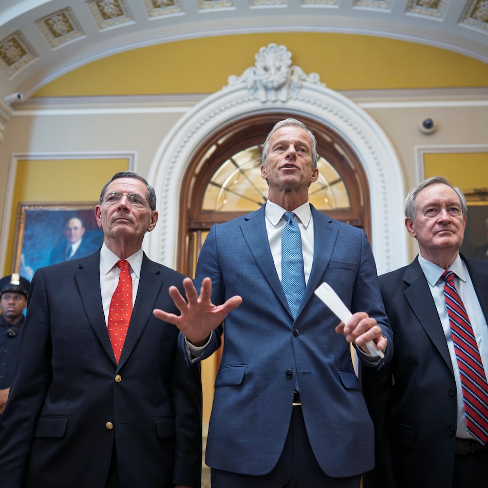 Senate Majority Leader John Thune, R-S.D. (center) is flanked by GOP whip Sen. John Barrasso, R-Wyo. (left) and Finance Committee Chairman Mike Crapo, R-Idaho, as Thune speak to reporters at the Capitol in Washington on Tuesday, July 1, 2025. Earlier Tuesday, the Senate passed the budget reconciliation package of President Donald Trump's signature bill of big tax breaks and spending cuts. (J. Scott Applewhite/AP)