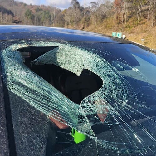 This photo provided by N. C. State Highway Patrol Public Information Office shows a smashed windshield after a cat carcass crashed into the car along a highway near the Great Smoky Mountains National Park in North Carolina on Wednesday, Nov. 19, 2025. (N. C. State Highway Patrol Public Information Office via AP)