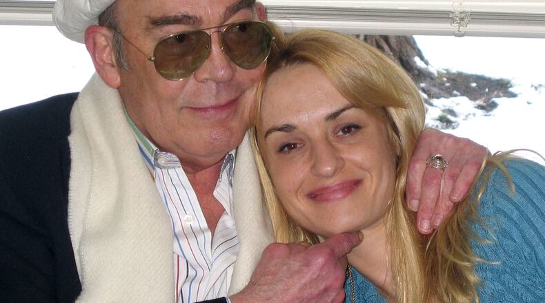 FILE - Journalist Hunter S. Thompson, left, and his wife, Anita Thompson, at the Pitkin County Court House in Aspen, Colo., on April 23, 2003, during their civil wedding ceremony. (AP Photo/Louisa Davidson, File)