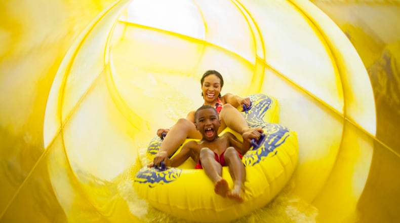 Bubbly fun: A mom and son hold on while enjoying a slide at Great Wolf Lodge.
(Courtesy of Great Wolf Lodge)