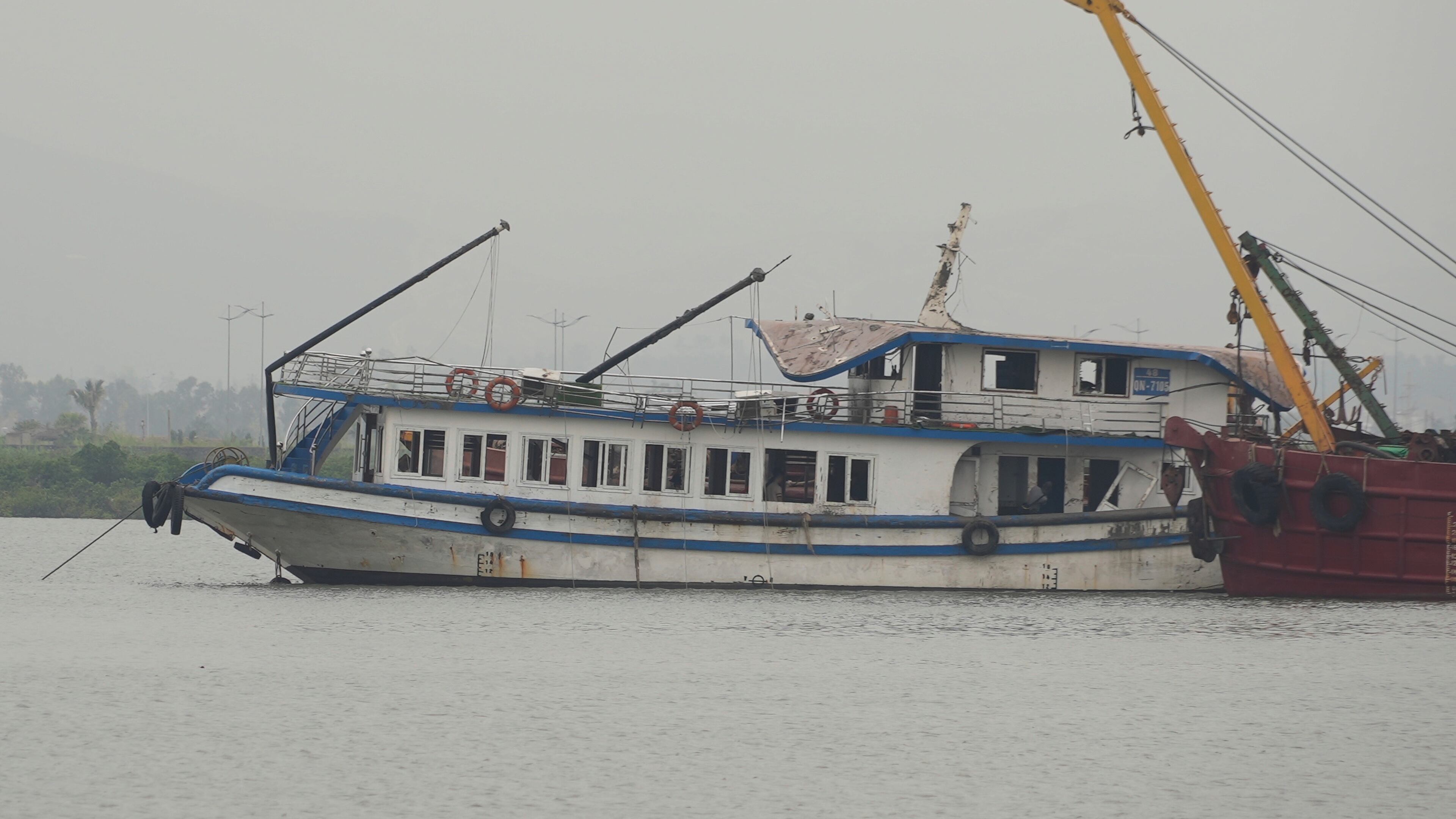 Tourist boat Wonder Sea is towed to a shipyard for investigation after its capsizing, which killed multiple people, in a thunderstorm in Ha Long Bay, Vietnam Sunday, July 20, 2025. (AP Photo/Huy Han)