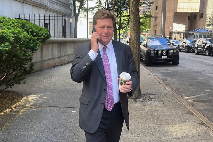 FILE - Acting U.S. Attorney for the Southern District of New York Jay Clayton talks on a phone as he exits court in New York, May 19, 2025. (AP Photo/Ted Shaffrey, File)