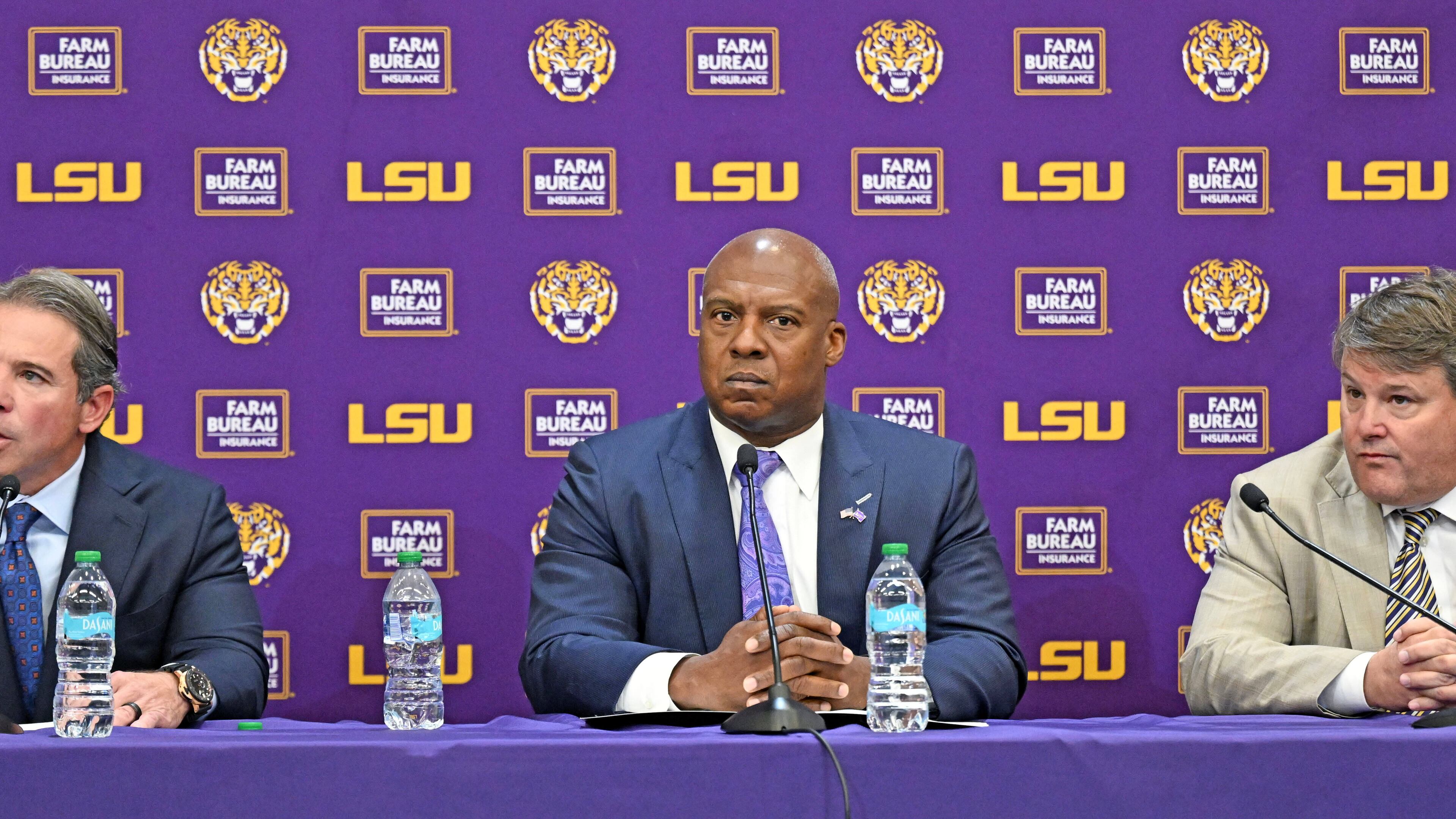 LSU board of supervisors member, from left, John H. Carmouche speaks alongside LSU interim athletic director Verge Ausberry and LSU board of supervisors chair Scott Ballard during a press conference to discuss the change in the LSU athletic department leadership, Friday, Oct. 31, 2025, in Baton Rouge, La. (Hilary Scheinuk/The Advocate via AP)