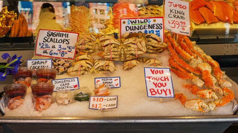 A display case of seafood at the Pike Place Market in Seattle. You touch, you buy! (Alan Behr/TNS)