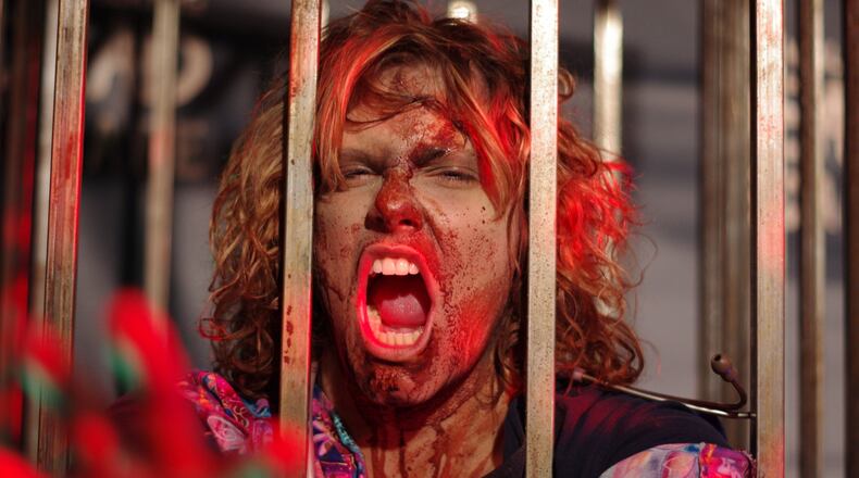 A ticket to “The Walking Dead Escape” live experience May 31 will enable you to become a zombie and chase after survivors at Philips Arena.