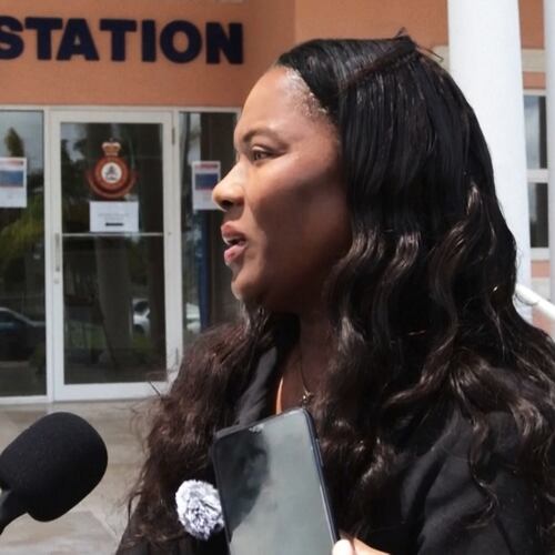 In this image taken from an Associated Press video Terrel Butler, the attorney representing Brian Hooker, talks to reporters Friday, April 10, 2026, outside the police station in Freeport, Bahamas. (AP Photo/Keith Gomez)