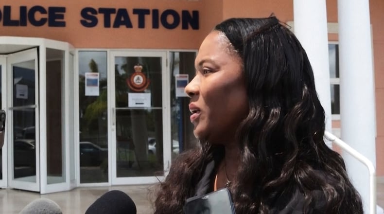 In this image taken from an Associated Press video Terrel Butler, the attorney representing Brian Hooker, talks to reporters Friday, April 10, 2026, outside the police station in Freeport, Bahamas. (AP Photo/Keith Gomez)