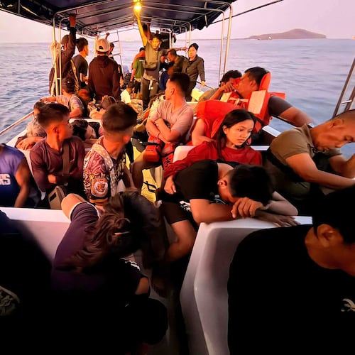 Rescued passengers from M/V Trisha Kerstin, 3 an inter-island cargo and passenger ferry that sank, on a boat around waters of Isabela City, Basilan Province, Philippines on Monday, Jan. 26, 2026. (Kagawad Gamar "Gams" Alih via AP)