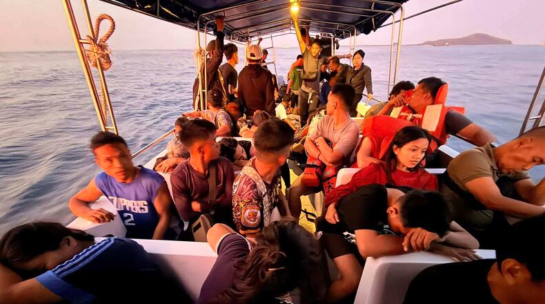 Rescued passengers from M/V Trisha Kerstin, 3 an inter-island cargo and passenger ferry that sank, on a boat around waters of Isabela City, Basilan Province, Philippines on Monday, Jan. 26, 2026. (Kagawad Gamar "Gams" Alih via AP)