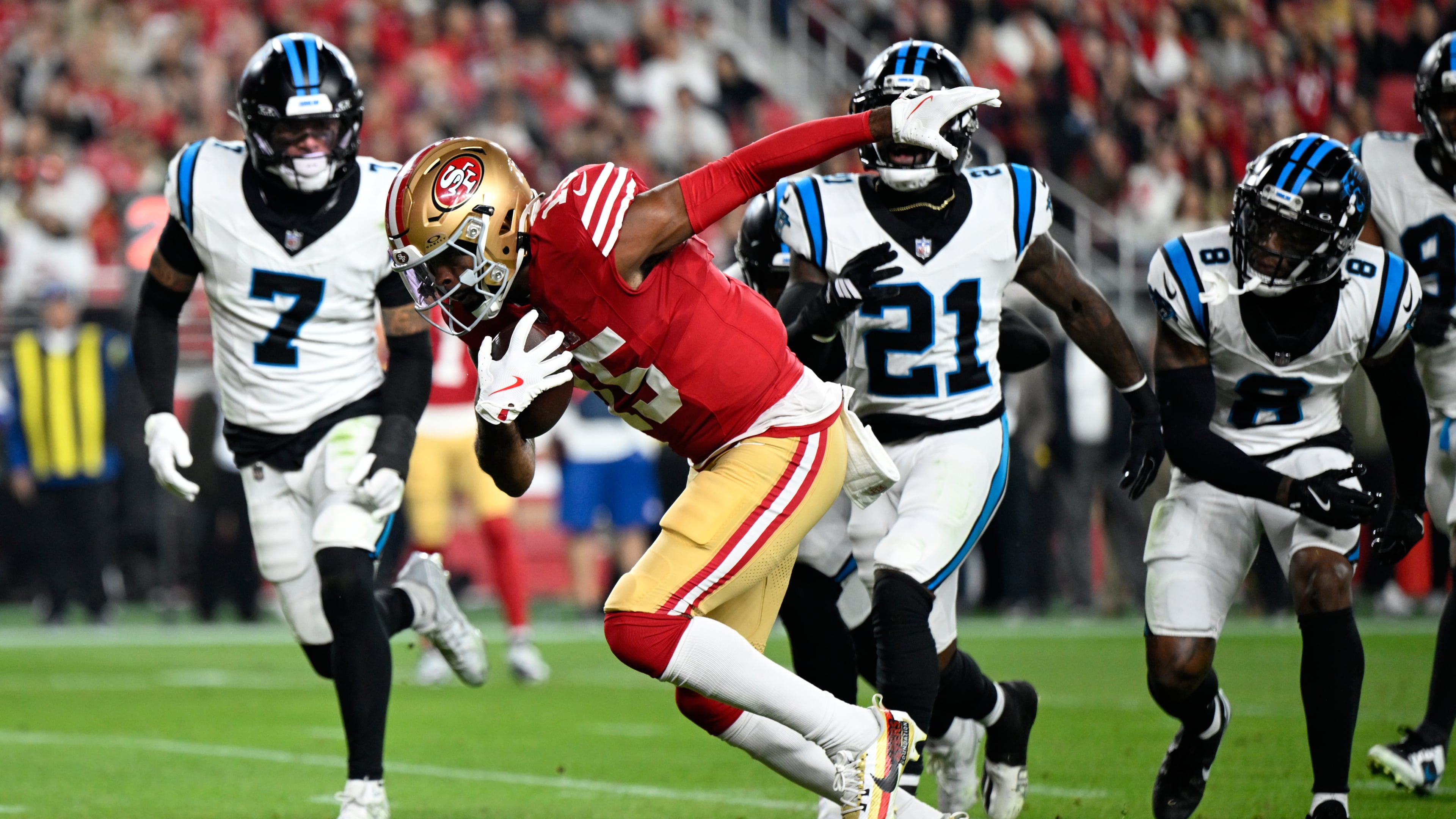 San Francisco 49ers wide receiver Jauan Jennings runs for a touchdown against the Carolina Panthers during the first half an NFL football game, Monday, Nov. 24, 2025, in Santa Clara, Calif. (AP Photo/Eakin Howard)