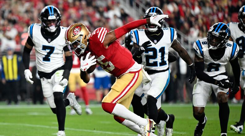 San Francisco 49ers wide receiver Jauan Jennings runs for a touchdown against the Carolina Panthers during the first half an NFL football game, Monday, Nov. 24, 2025, in Santa Clara, Calif. (AP Photo/Eakin Howard)