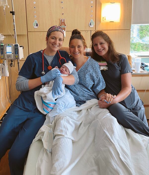 At Northeast Georgia Medical Center, Mary Kate Harris (center) celebrates her baby's birth with her mom, Sarah Rushton (right) and her twin, Mckenna Roberts. (Courtesy of Northeast Georgia Medical Center)