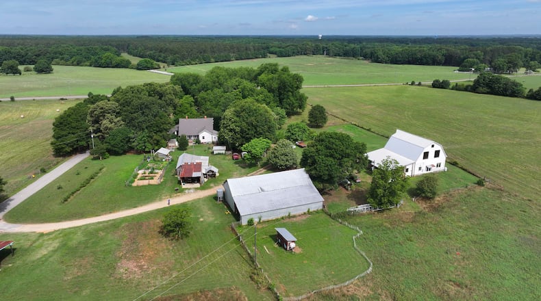 An aerial image shows the Breedlove family farm near Watkinsville in Oconee County on Thursday, May 29, 2026. A proposed highway bypass would cut through the 350-acre property. (Miguel Martinez/AJC)