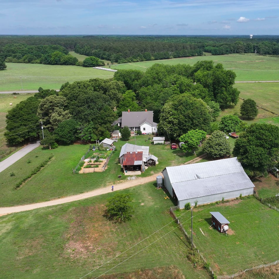 An aerial image shows the Breedlove family farm near Watkinsville in Oconee County on Thursday, May 29, 2026. A proposed highway bypass would cut through the 350-acre property. (Miguel Martinez/AJC)