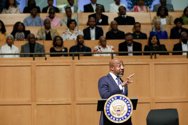 U.S. Sen. Raphael Warnock, D-Ga., answers a question from a member of the audience during a town hall meeting at Zion Hill Baptist Church in South Atlanta on Sunday.