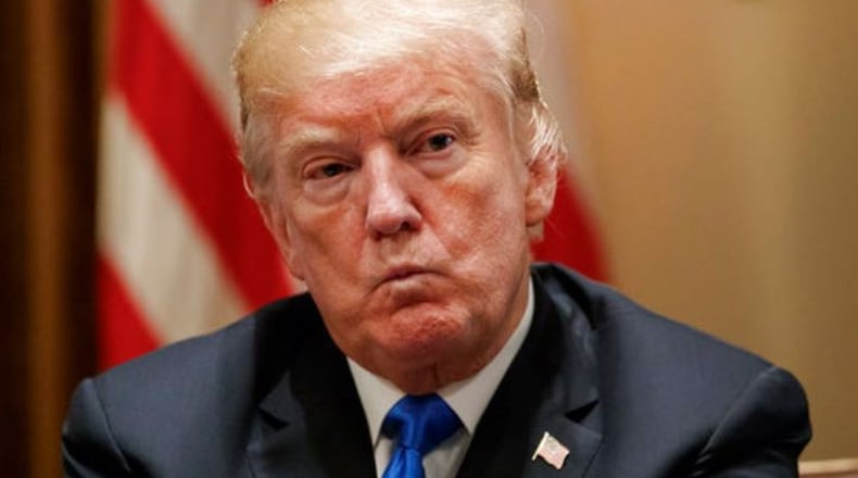 President Donald Trump pauses during a meeting in the Cabinet Room of the White House, Feb. 28, 2018, with members of Congress to discuss school and community safety. (AP Photo/Carolyn Kaster)