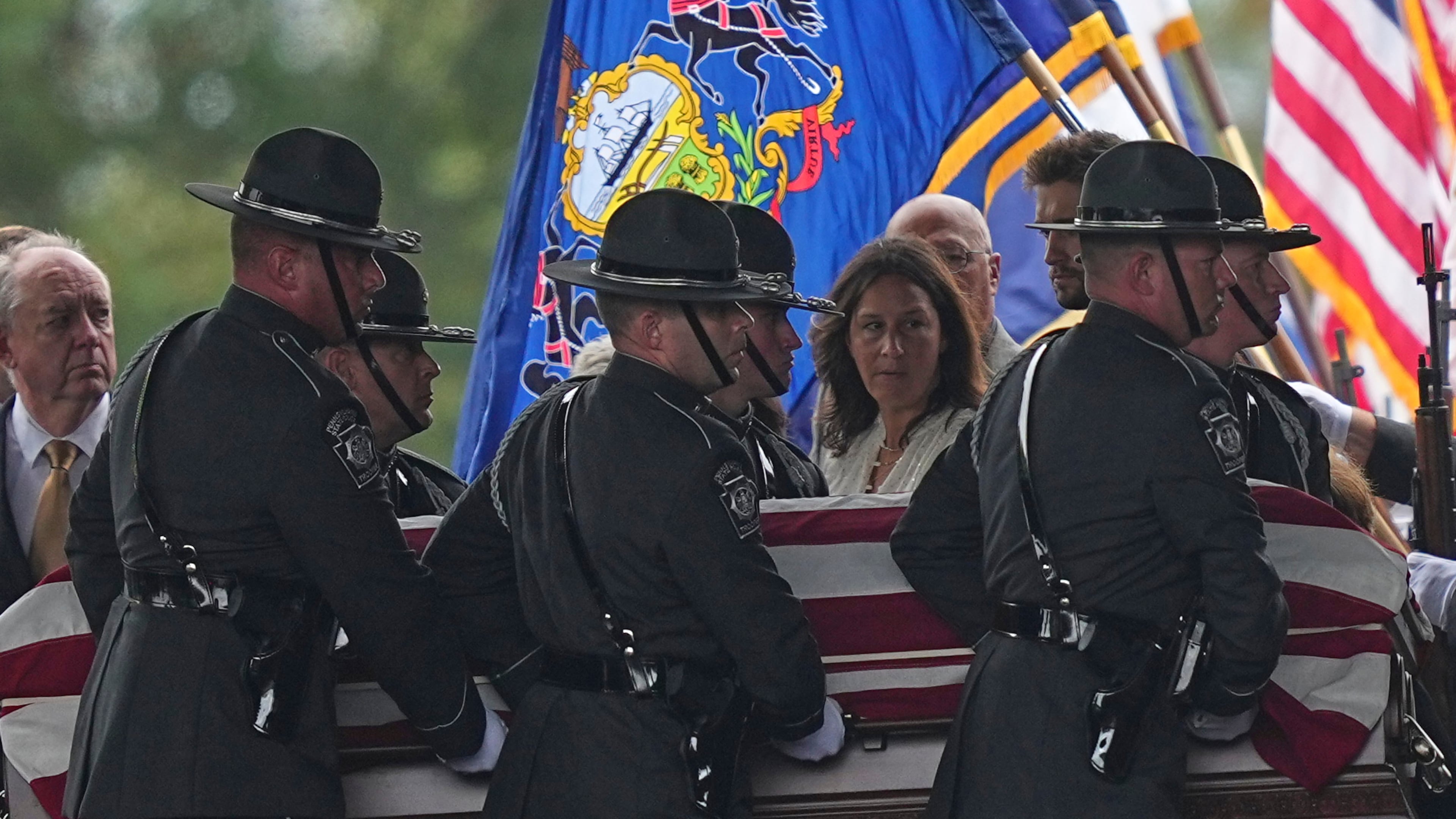 Pall bearers carry the coffin of a slain officer during funeral services for Northern York County Regional Police detectives Cody Michael Becker, Mark Edward Baker and Isaiah Emenheiser, Thursday, Sept. 25, 2025, in Red Lion, Pa. (AP Photo/Matt Rourke)