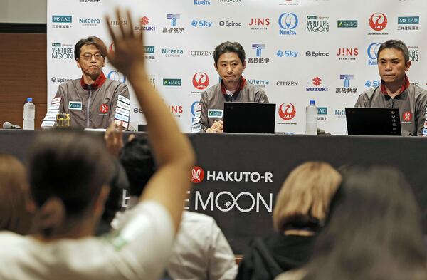 ispace CEO and founder Takeshi Hakamada, center, attends a press conference about their private lunar lander's attempt on the moon Friday, June 6, 2025, in Tokyo, Japan. (Kyodo News via AP)