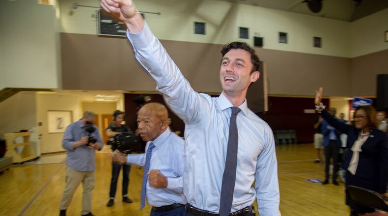 U.S. Senate candidate Jon Ossoff (foreground) and U.S. Rep. John Lewis wave to the crowd at the start of a voter registration rally at the MLK Recreation Center in Atlanta on Saturday, September 28, 2019. (Photo: STEVE SCHAEFER / SPECIAL TO THE AJC)