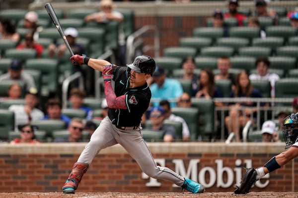 Arizona Diamondbacks' Corbin Carroll (7) hits a double against the Atlanta Braves in the ninth inning of a baseball game, Thursday, June 5, 2025, in Atlanta. (AP Photo/Mike Stewart)