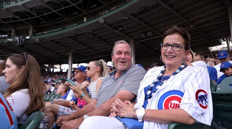 John Hendricks has a laugh with his wife, Ann Marie Hendricks, as the couple watches their son, Chicago Cubs starting pitcher Kyle Hendricks, as he faces the St. Louis Cardinals in the first inning of a game at Wrigley Field in Chicago on Thursday, July 19, 2018.  (Chris Sweda/Chicago Tribune/TNS)