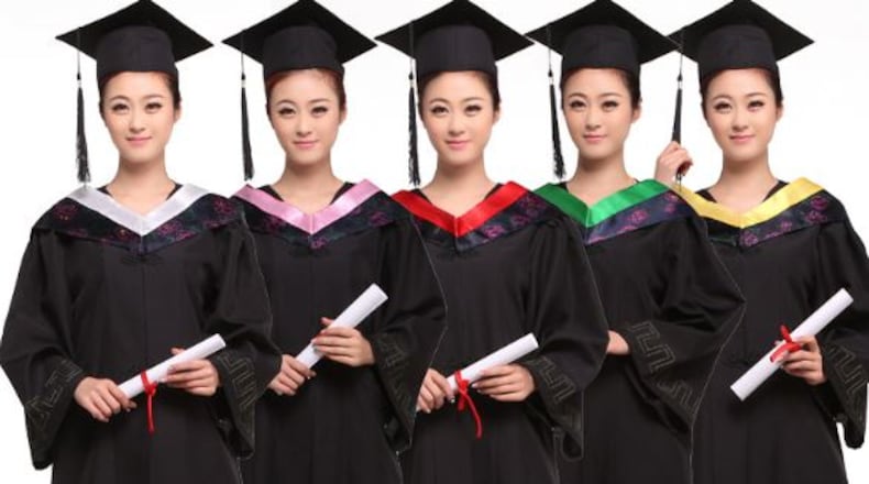 A high school in Paulding County told girls they had to wear dresses under their graduation robes, leading to complaints and now a policy change, Even advertisements for graduation gowns feature female models in pants .