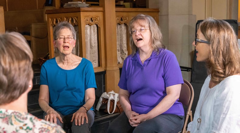 Voices of Love Threshold Choir members Ann Lillya (from left), Rose Watkins, Jeanne Williams and Susan Patterson, practice together at Emory Presbyterian Church in Decatur. PHIL SKINNER FOR THE ATLANTA JOURNAL-CONSTITUTION
