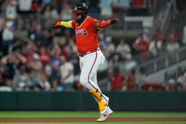 Atlanta Braves designated hitter Marcell Ozuna (20) celebrates his three-run homer against the Colorado Rockies in the seventh inning of a baseball game, Friday, June 13, 2025, in Atlanta. (AP Photo/Mike Stewart)