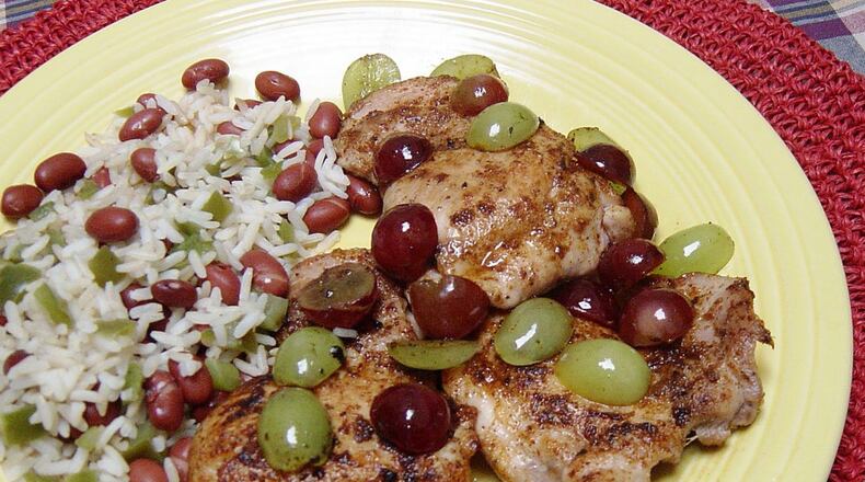 Cajun chicken. Hot Cajun spices are contrasted with sweet grapes. (Linda Gassenheimer/TNS)