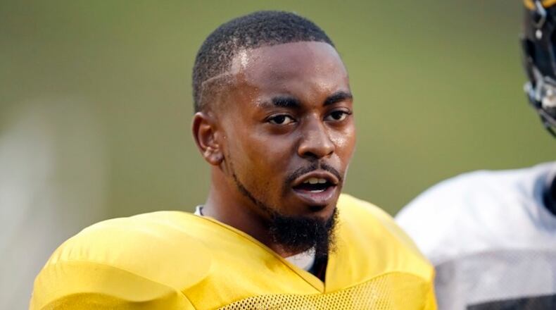 Grambling's senior quarterback Devante Kincade speaks to other offensive players during practice, Thursday, Nov. 16, 2017, at Eddie G. Robinson Memorial Stadium in Grambling, La. Kincade, who played two seasons at Ole Miss, says playing football at a Historically Black College or University is an experience to savor. Playing at an HBCU is not just about entertaining halftime shows the schools are known for, it's about community. (AP Photo/Rogelio V. Solis)