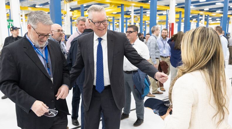 Delta CEO Ed Bastian talks with people after a Ribbon-cutting at deltas new Geared Turbofan shop Tuesday, Feb. 7, 2023  (Steve Schaefer/steve.schaefer@ajc.com)