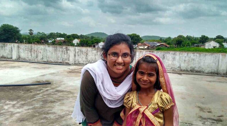Sravya Ambadipudi, a senior at Northview High School in Johns Creek, spent two weeks this summer in a rural village in India. She taught English to Naishita and other young children. CONTRIBUTED
