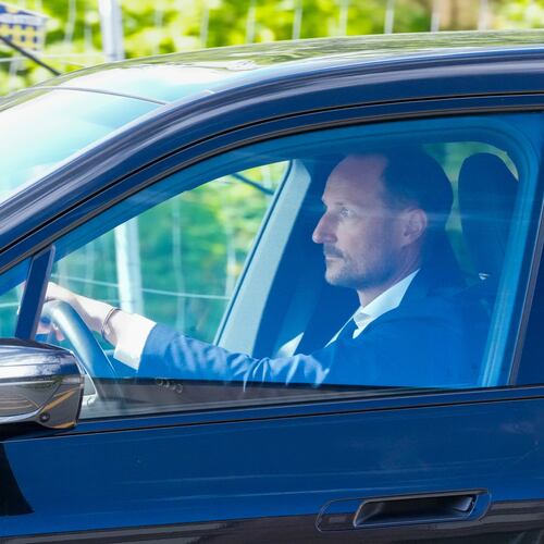 Norwegian Crown Prince Haakon drives a car on his way to the National Hospital in Oslo, Monday, Aug. 24, 2026. (Ole Berg Rusten/NTB Scanpix via AP)
