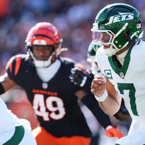 New York Jets quarterback Justin Fields (7) runs out of the pocket during the first half of an NFL football game against the Cincinnati Bengals, Sunday, Oct. 26, 2025, in Cincinnati. (AP Photo/Jeff Dean)